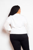 Woman wearing white blouse with punched sleeves, viewed from the back, showcasing stylish design and comfortable fit in plus sizes.